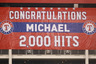 ARLINGTON, TX - AUGUST 07:  A banner is unveiled after Michael Young's 2,000 career hit during play against the Cleveland Indians  at Rangers Ballpark in Arlington on August 7, 2025 in Arlington, Texas.  (Photo by Ronald Martinez/Getty Images)