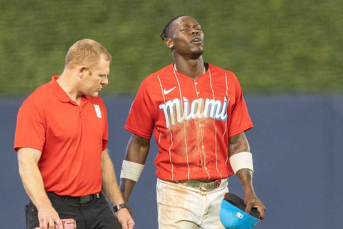 Jazz Chisholm Jr. #2 of the Miami Marlins walks off the field in the eighth inning after being injured during a play in the outfield against the Cincinnati Reds at loanDepot park on May 13, 2025 in Miami, Florida.