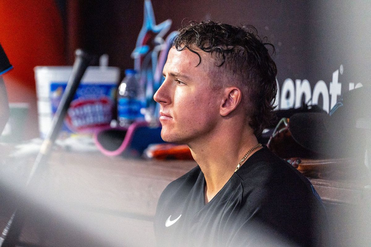 Peyton Burdick stares out from the Marlins dugout during a 2022 regular season game