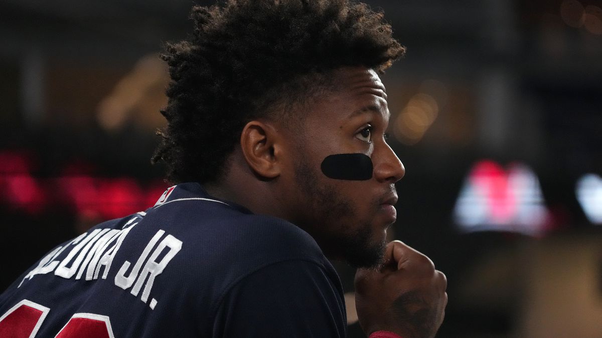 Atlanta Braves right fielder Ronald Acuna Jr. (13) stands in the dugout doing the ninth inning against the Miami Marlins at loanDepot park.