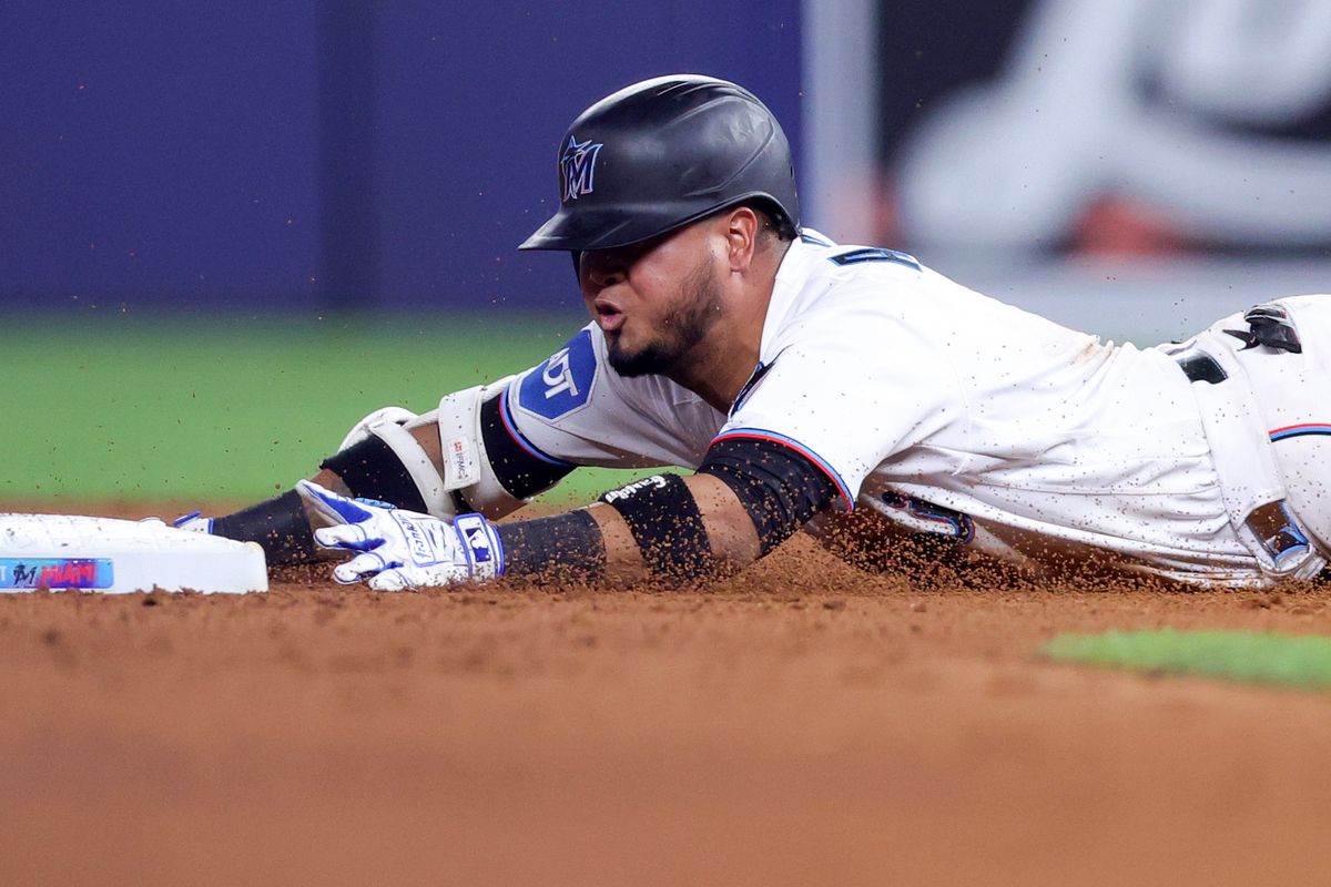 Luis Arraez #3 of the Miami Marlins slides to second base against the Washington Nationals during the eighth inning at loanDepot park on May 17, 2025 in Miami, Florida.