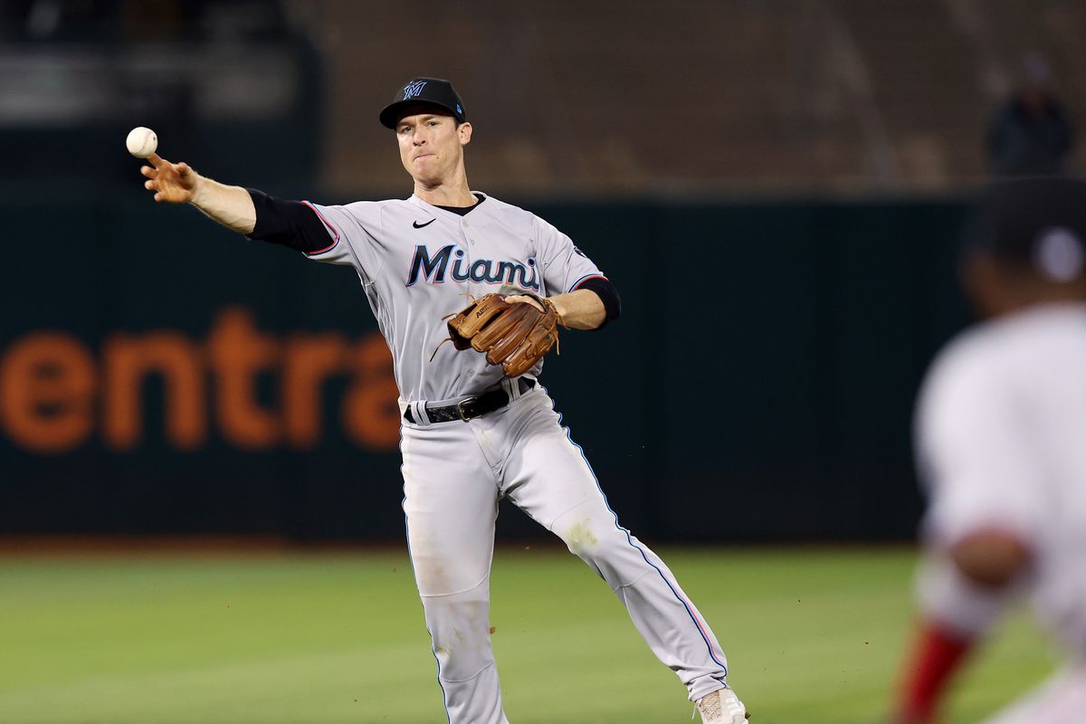 Joey Wendle #18 of the Miami Marlins throws out Cal Stevenson #37 of the Oakland Athletics in the fourth inning at RingCentral Coliseum on August 22, 2025 in Oakland, California.